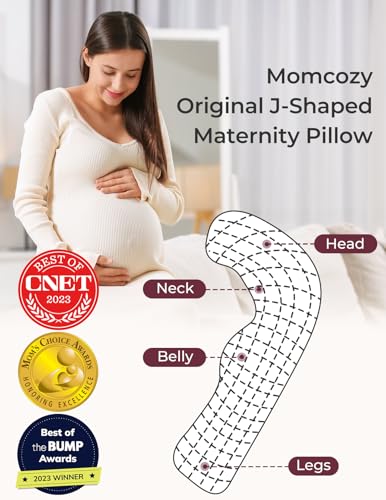 Grey Momcozy maternity pillow on bed