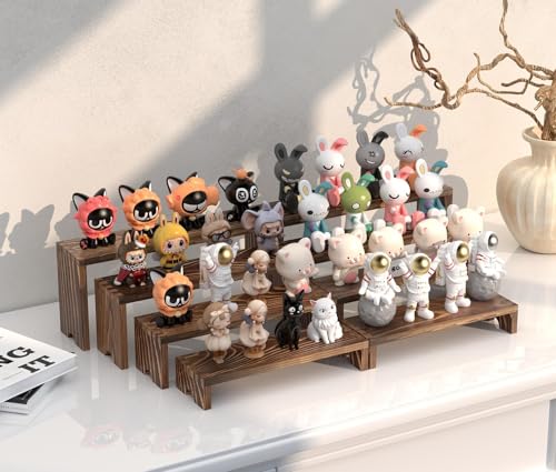 Tiered display stands showcasing perfume bottles on a vanity