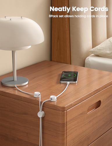 Cable management clips on a desk surface