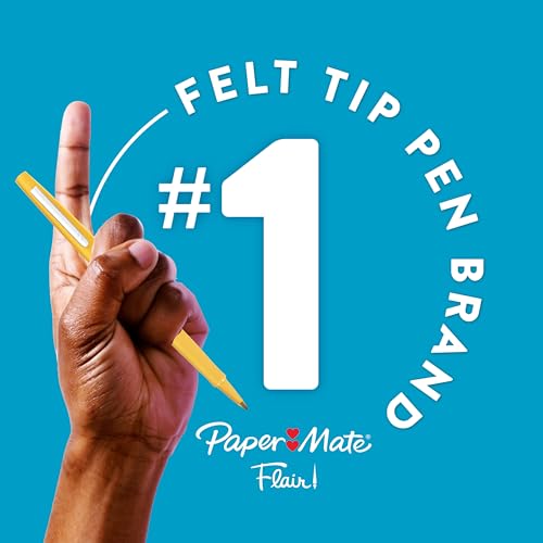Hand using Paper Mate Flair pens for journaling