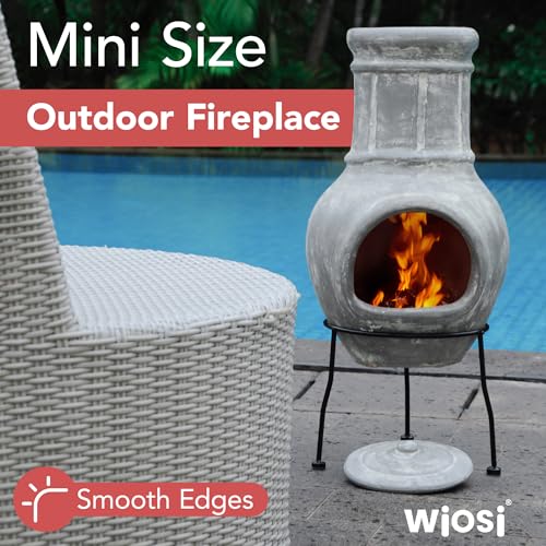 Small clay outdoor fireplace with metal stand