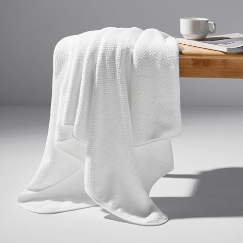 REDKISS towel set stacked in bathroom