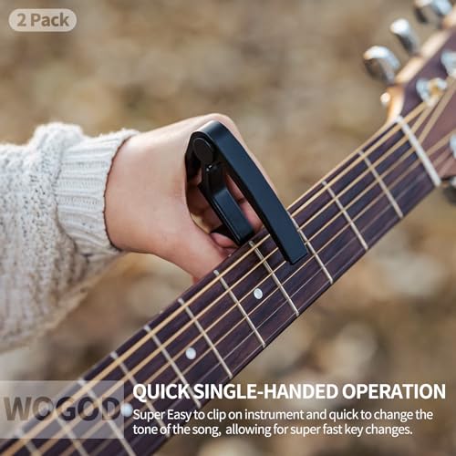Guitar capo spring tension mechanism