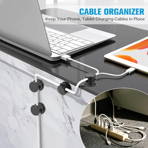 Black cable clips mounted on a desk