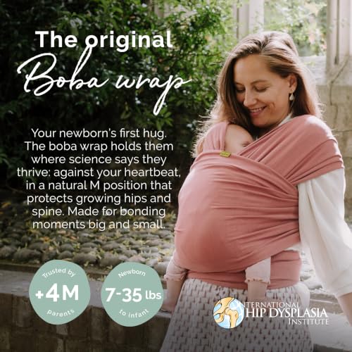 Parent wearing baby in Boba Dusty Pink wrap
