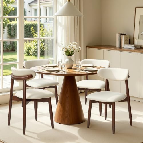 Four chairs arranged in a dining setting