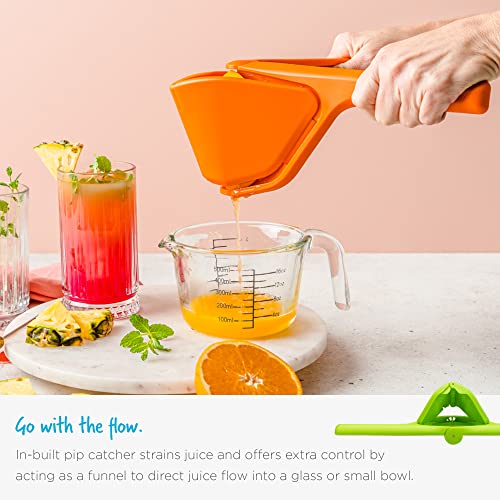 Hand operating the Dreamfarm citrus press