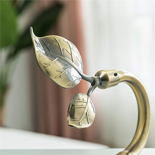 Antique brass finish on curtain holdback
