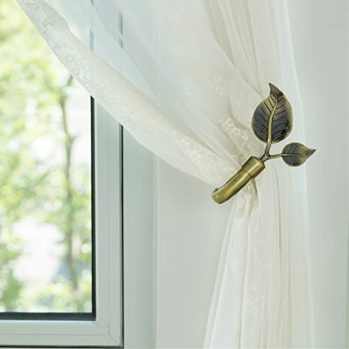 Set of two leaf shaped metal drapery holders
