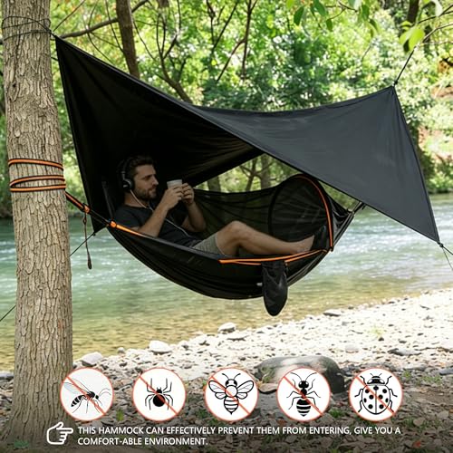 Rain fly tarp extended over camping hammock