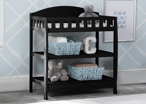 Side view of Delta Children changing table with two shelves