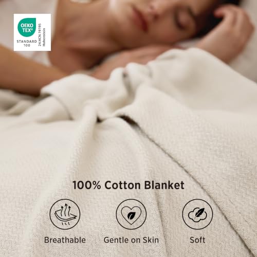 Linen Beige blanket draped on bed