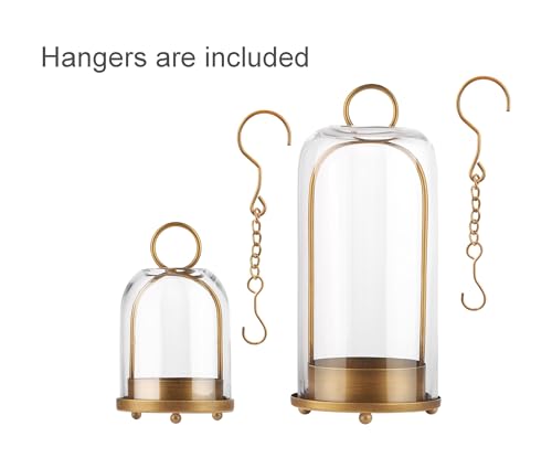 Large and small brass hurricane lanterns on a table