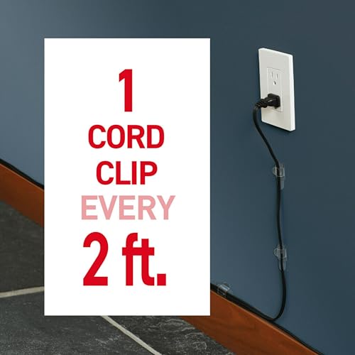 Command cord clips applied to wooden surface