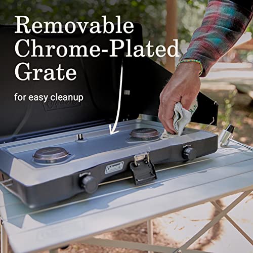 Coleman Triton stove with pots on the burners