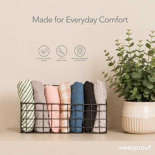 Caregiver holding baby in WeeSprout wrap
