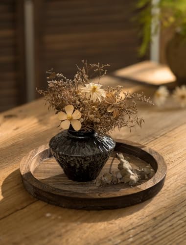 Hanobe tray holding a vase and candles