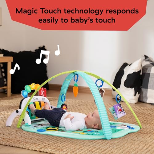 Baby lying on the Farm Explorers 4-in-1 activity mat