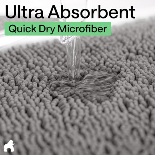 Gray bath mat in modern bathroom setting