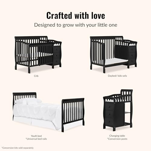 Black nursery crib with changing pad