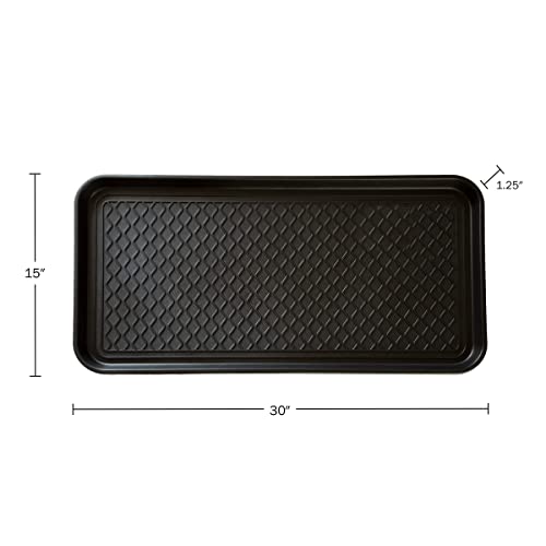 Two black plastic shoe trays in entryway