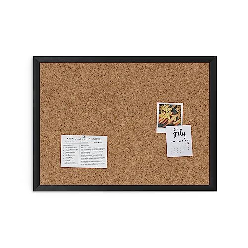U Brands cork board mounted vertically on office wall