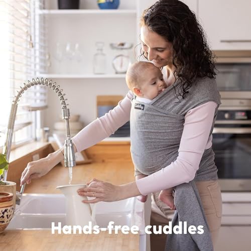 Parent adjusting CuddleBug baby wrap