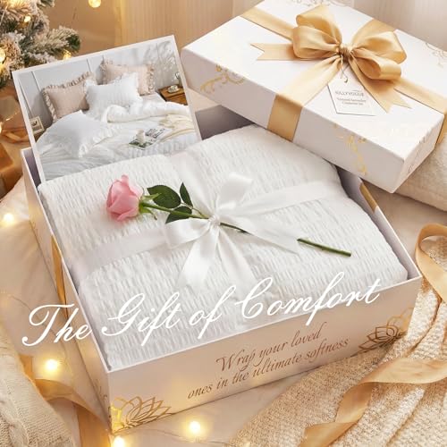 Folded white ruffle comforter showing filling