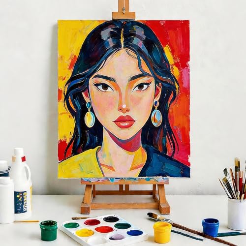 Assorted painting supplies with canvas boards