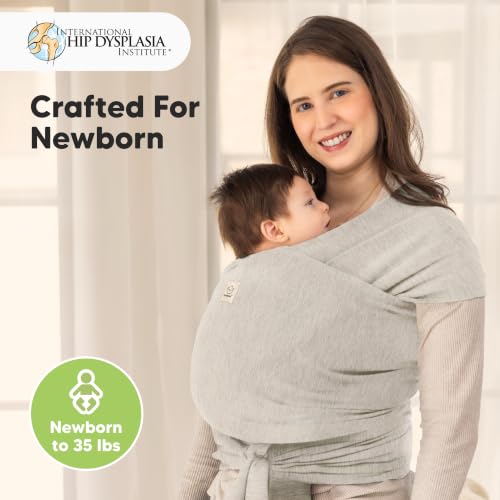 Parent wearing baby in KeaBabies Stone Gray wrap