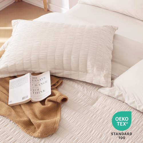 Beige bedding set in a bedroom setting
