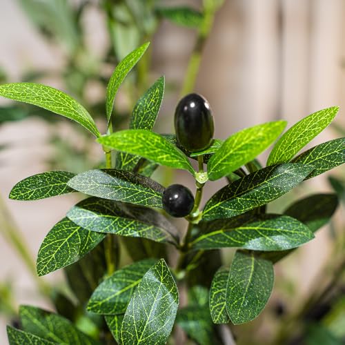 Artificial olive tree in a bright living room